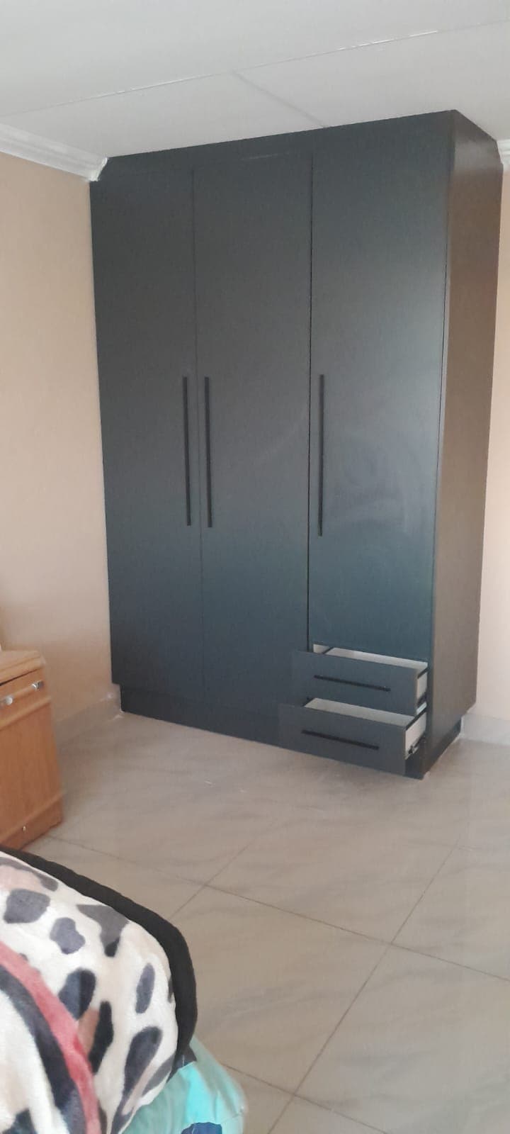Charcoal three-door bedroom wardrobe